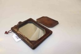 Interesting leather mounted mirror,