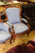 Victorian walnut framed gents open armchair in blue floral pattern fabric