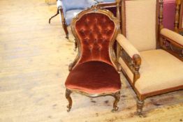 Victorian carved mahogany framed nursing chair on carved cabriole legs in deep buttoned draylon