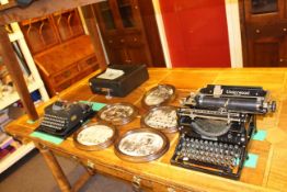 Two vintage Imperial and Underwood typewriters and set of five oval photographs