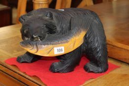 Carved wood bear with fish