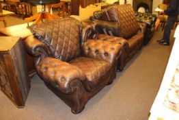 Brown buttoned leather two seater settee,