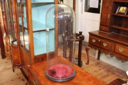 Tall glass dome on base,