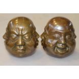 Pair of Chinese bronze buddha heads,
