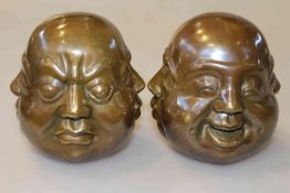 Pair of Chinese bronze buddha heads,