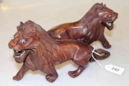 Pair of carved models of lions