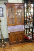 Early 20th Century oak bureau bookcase having two glazed panel doors above a fall front with a