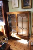 Early 20th Century mahogany china cabinet having two glazed panel doors above two drawers on