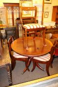 Circular mahogany pedestal dining table and four bar back dining chairs