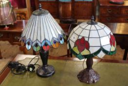 Two bronze finished table lamps with stained glass shades