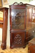 Good late 19th/early 20th Century carved mahogany standing corner cabinet having swan neck pediment