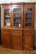 Victorian mahogany breakfront bookcase, with moulded cornice above three glazed doors,