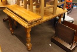 Oak extending dining table with two leaves and pair of mahogany occasional chairs