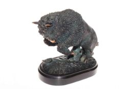 Patinated model of a rearing buffalo