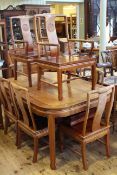 Chinese rosewood extending dining table with two leaves and set of eight dining chairs (6+2)