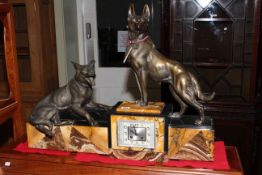 Striking marble and spelter mantel clock, surmounted by two German Shepherd dogs,