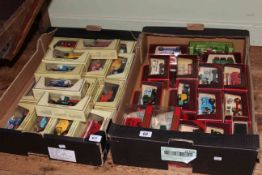 Two boxes of model cars