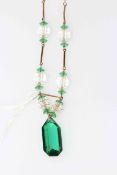 9 carat gold necklace with green 'stones'