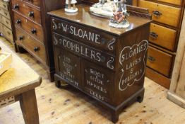 Mahogany cupboard stenciled with slogans for Sloans Cobblers