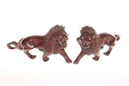 Two carved lion models