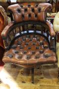 Brown buttoned leather office swivel chair