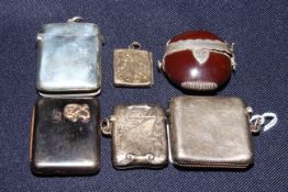 Three silver vesta cases, vesta with gold mount (unmarked), silver stamp case,