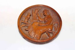 Carved circular plaque