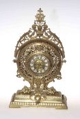 Ornate gilt metal mantel clock with enamelled numerals