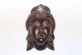 Carved wooden female head