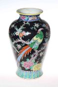 Chinese pottery vase with floral decoration on black ground,