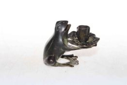 Patinated bronze frog-form candle holder