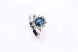 18 carat gold oval sapphire and diamond cluster ring