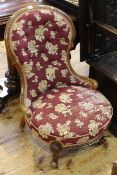 Victorian mahogany spoon back nursing chair in button floral pattern fabric