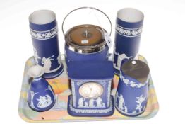 Six pieces of Wedgwood blue Jasperware including vase, clock,