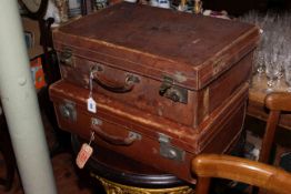 Two vintage leather suitcases,