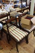 Set of four Regency style mahogany sabre leg dining chairs