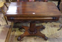 Victorian mahogany fold top tea table on octagonal tapering pedestal to quadriform base