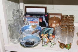 Three glass decanters and glasses, collectors plates, wooden tobacco jar, binoculars,