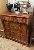 Victorian mahogany chest of two short above three long drawers on bun feet