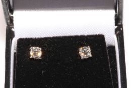 Pair of 18 carat gold an diamond stud earrings