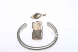 Georg Jensen ring, bangle, pair of clip earrings and pendant,