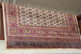 Bokhara carpet with a beige ground 2.80 by 2.