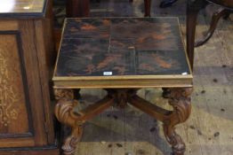Low carved table with Oriental design lacquered top,