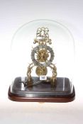 Brass single fusee skeleton clock under glass dome