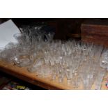 Large quantity of crystal and other glassware including vases, bowls, sundae dishes,