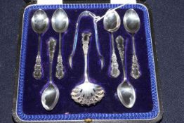Set of six silver teaspoons, tongs and sifting ladle,