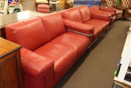 Natuzzi red leather three piece lounge suite comprising two settees and chair