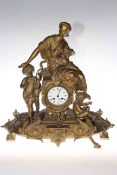 Ornate gilt metal figural mantel clock with enamel dial