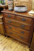 Late Victorian walnut chest of two short above three long drawers on turned legs