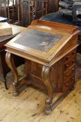 Victorian mahogany Davenport having four side drawers and scrolled supports,